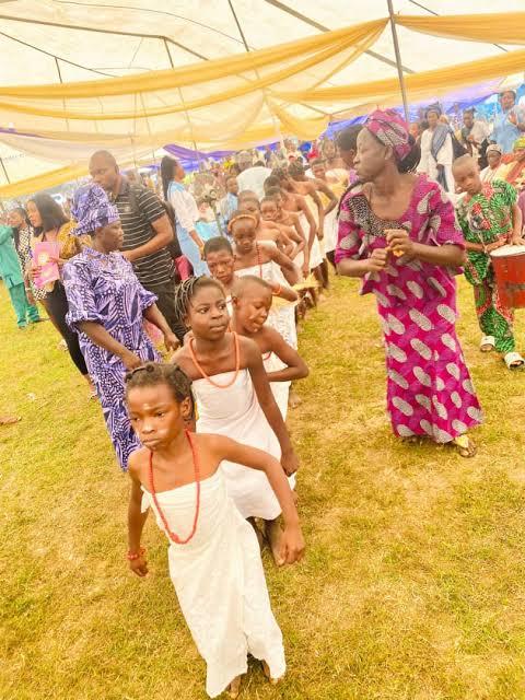 Children in a cultural procession at a Takete-Ide celebration